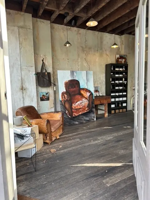 The Le Labo armchair painting seen through the doorway