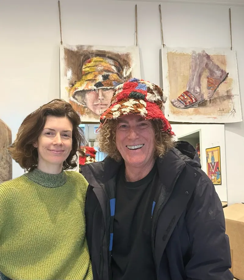 Dale Hunt and Calla Haynes inside the Calla Paris boutique with the artwork