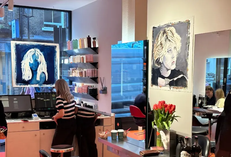 Portraits hung throughout the Feel Soho salon during Allure